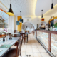 L'image montre l'intérieur d'un restaurant chaleureux et accueillant, Le Bourg-Ville à Martigny extraite d'une visite virtuelle